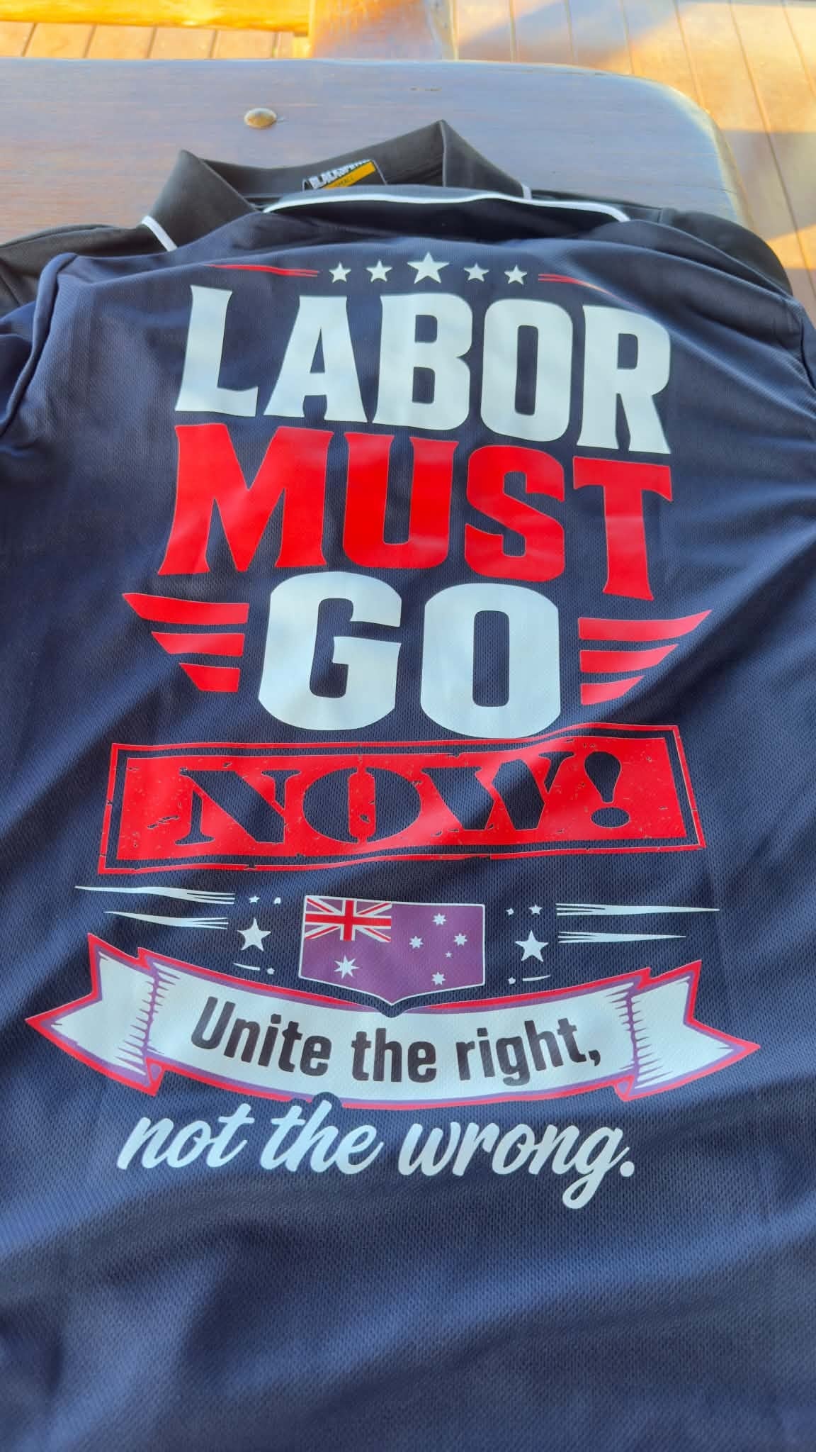 Labor Must Go Now collared shirt — back print with bold graphic design